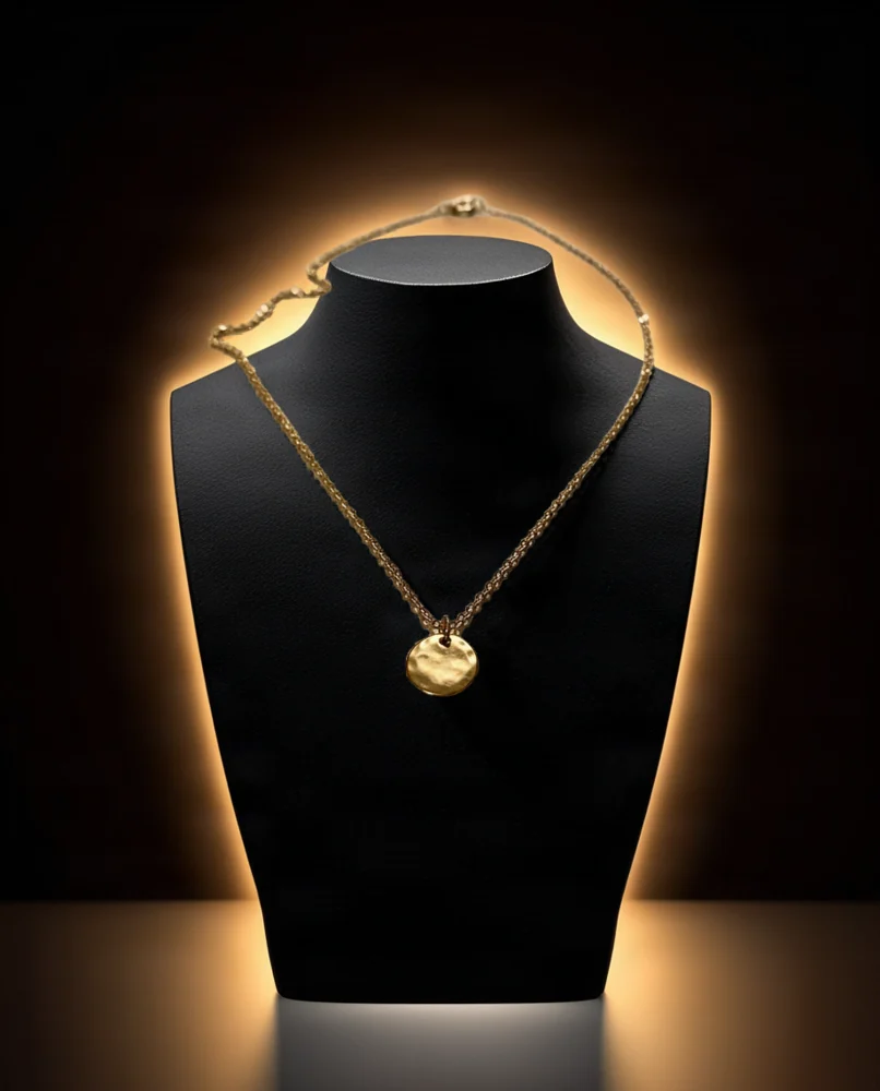 Gold pendant necklace: dark luxury scene